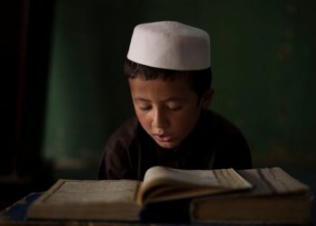 An Afghan student reads the Quran, Islam's holy book, at a madrasa in Kabul, Afghanistan, Tuesday, Sept. 28, 2021. (AP Photo/Felipe Dana)