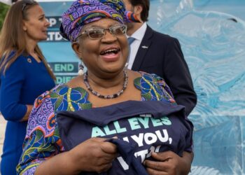 Nigeria's Ngozi Okonjo-Iweala, Director General of the World Trade Organisation (WTO), attends an event on World Ocean Day with Finley the fish, made of ice, on place des Nations before of the World Trade Organization (WTO) Ministerial Conference (MC