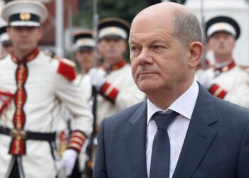 German Chancellor Olaf Scholz walks past the honor guard accompanied by North Macedonia's Prime Minister Dimitar Kovacevski, during a welcome ceremony at the government building in Skopje, North Macedonia, on Saturday, June 11, 2022. German Chancello