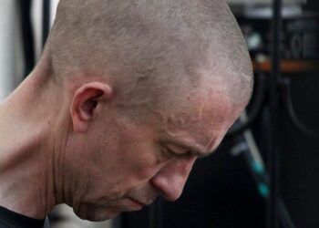 British citizen Shaun Pinner sits behind bars in a courtroom in Donetsk, in the territory which is under the Government of the Donetsk People's Republic control, eastern Ukraine, Thursday, June 9, 2022. Two British citizens and a Moroccan have been s
