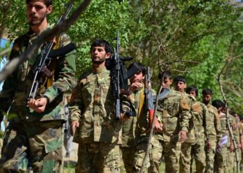 FILE- Militiamen loyal to Ahmad Massoud, son of the late Ahmad Shah Massoud, take part in a training exercise, in Panjshir province, northeastern Afghanistan, on Aug. 29, 2021. Taliban security forces in northern Afghanistan have unlawfully detained