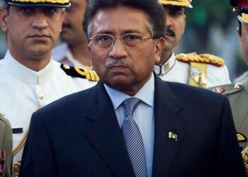 FILE - Outgoing President Pervez Musharraf is surrounded by top military officers as he leaves the Presidential House in Islamabad, Pakistan on Aug. 18, 2008, file photo. Musharraf, Pakistan's former military ruler, is critically ill and has been hos