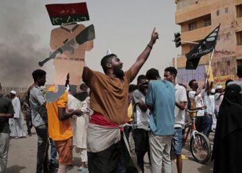 Sudanese protesters commemorate the third anniversary of a deadly crackdown carried out by security forces on protesters during a sit-in outside the army headquarters, in Khartoum, Sudan, Friday, June 3, 2022. Talks aiming at ending Sudan’s ongoing p