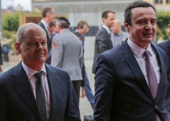 German Chancellor Olaf Scholz, left, walks with Kosovo Prime Minister Albin Kurti, in the Kosovo capital Pristina, Friday, June 10, 2022. Scholz is on a one day visit to the country. (AP Photo/Visar Kryeziu)