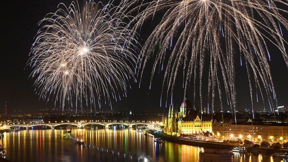 Fireworks explode above the River Danube as part of the postponed celebrations of the country's major national holiday in downtown Budapest, Hungary, Saturday, Aug. 27, 2022. Each year on 20th August Hungarians commemorate the foundation of their sta