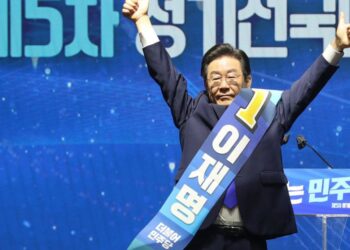 South Korean lawmaker Lee Jae-myung gestures after he was elected as a South Korea's main opposition Democratic Party's chairperson during the party's convention in Seoul, South Korea, Sunday, Aug. 28, 2022. (Korea Pool/Yonhap via AP)