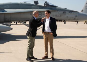 NATO Secretary General Jens Stoltenberg and Prime Minister Justin Trudeau say goodbye at 4 Wing Cold Lake air base in Cold Lake Alta, on Friday Aug. 26, 2022. (Jason Franson /The Canadian Press via AP)